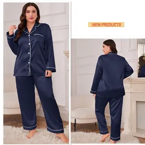 Women's dark blue satin pajama set with long sleeves and white piping in an elegant room