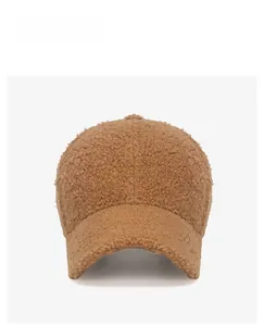 Close-up of caramel plush sherpa baseball cap with white Saturday embroidery