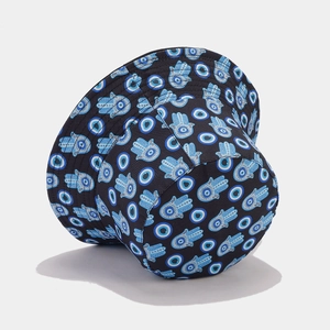 Reversible bucket hat featuring blue Hamsa Hand and Evil Eye print on black fabric