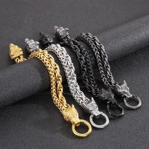 Detailed view of men's double-row wolf head bracelets in gold, silver, black and gunmetal