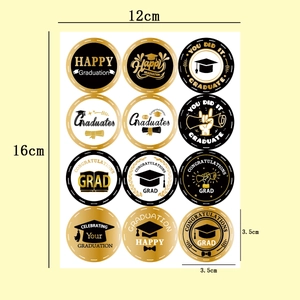 Detail of 12 black and gold graduation stickers with various celebratory designs