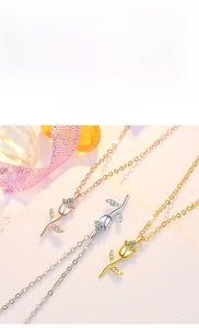 Detail of rose pendant necklace in gold, silver and rose gold with pavé-set zircons