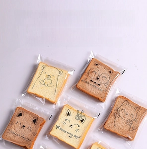 Close-up of food-grade OPP bread bags featuring cute cartoon animal illustrations