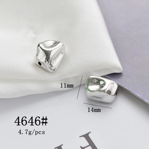 Macro detail of silver punk-style alloy heart pendants showing 11mm and 14mm sizes