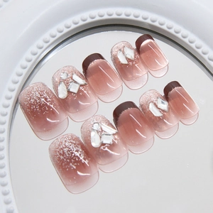 Sparkling reddish brown French press-on nails with glitter and 3D rhinestones