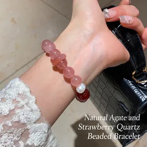 Natural strawberry quartz bracelet with fresh water pearl and agate on woman's wrist