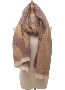 Detail of soft brown and beige plaid boucle scarf featuring classic fringe tassels