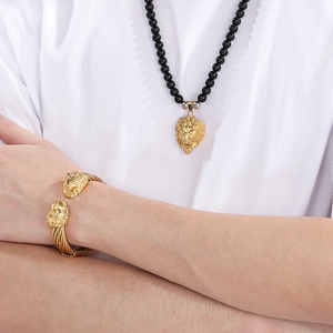 Men's 18K gold lion head bangle with matching black onyx bead necklace set