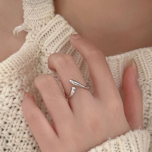Minimalist 925 sterling silver U-shaped open ring worn on hand with knit background