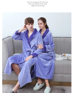 Detail of purple coral fleece bathrobe featuring textured waffle pattern collar and cuffs