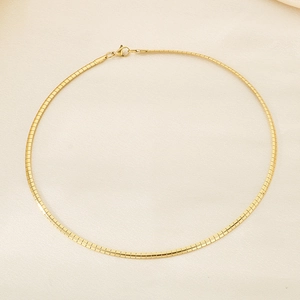 Detailed view of 18K gold plated titanium steel omega chain with lobster clasp closure