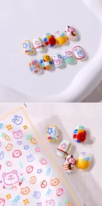 Detail of 3D embossed nail art stickers with bear, rabbit and strawberry patterns