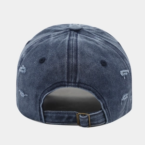Detailed back view of vintage washed denim baseball cap with metal buckle and ripped edge