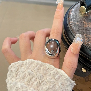 Close-up of a silver polished dome ring with vintage French style and mirror finish