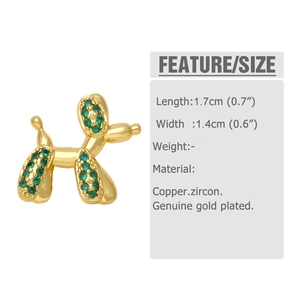 Close-up of gold plated balloon dog earring with inlaid green zircon stones and details