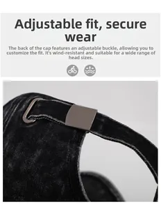 Detail of adjustable metal buckle and washed denim fabric on distressed baseball cap