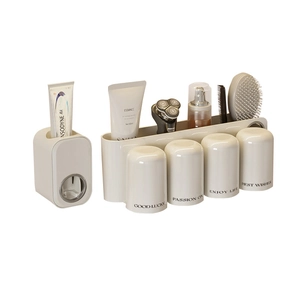 Creamy white wall-mounted toothpaste dispenser and 4-cup toothbrush holder bathroom set