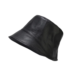 Chic black faux leather bucket hat for women featuring a minimalist solid color design