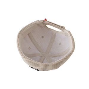 Beige corduroy docker hat for boys featuring adjustable strap and soft inner lining