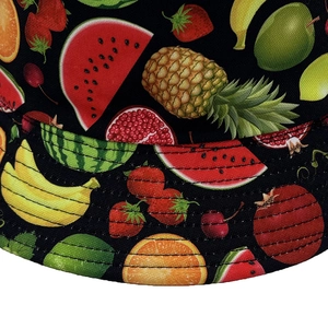 Black reversible sun hat for women featuring colorful tropical fruit print and fine stitching