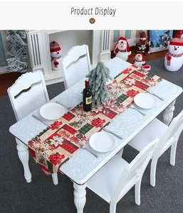 Detailed view of Christmas poinsettia printed table runner in festive holiday setting