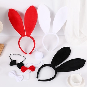 Three-piece plush bunny costume set with headband, bowtie, and tail on white background