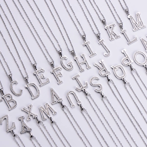 Detailed collection of 26 silver A-Z letter necklaces featuring sparkling crystal rhinestones