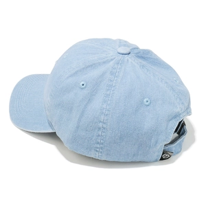 Detail of light blue washed denim baseball cap with adjustable strap and branding label