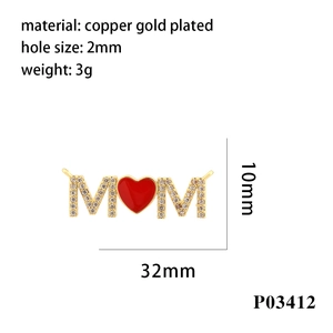 Detailed view of gold MOM pendant with red enamel heart and cubic zirconia accents