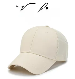 Detail of breathable mesh splicing and cotton fabric on a beige baseball cap