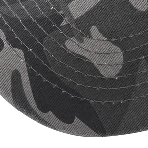 Macro shot of camo baseball cap brim showing twill texture and sturdy curved stitching