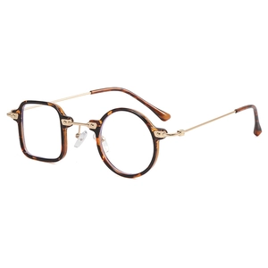 Asymmetric tortoise shell sunglasses with gold metal temples and brown square-round frames