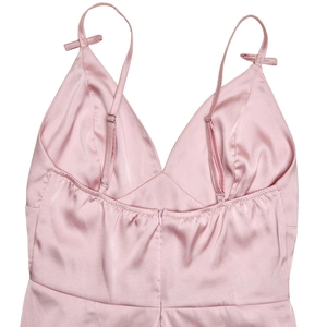 Detail of pink satin dress back with adjustable thin straps and invisible zipper