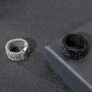 Detail of industrial punk rock braided chain mesh texture on men's steel rings