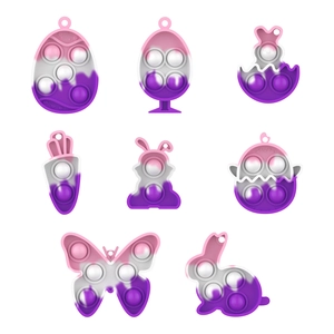 Detail view of Easter Pop It keychains in rabbit and egg shapes with gradient colors