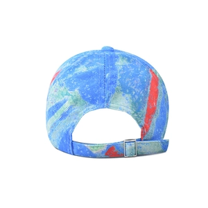 Detail of adjustable metal buckle and marble tie-dye pattern on cotton baseball cap