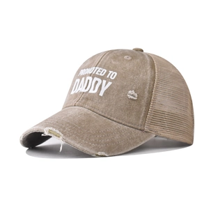 Detail of distressed cotton mesh baseball cap with white Promoted To Daddy text