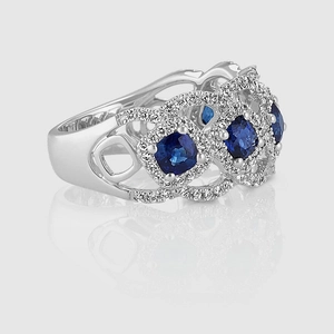 Macro view of blue sapphire ring featuring hollow wave patterns and white diamonds