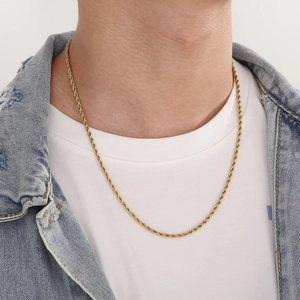 Close-up of a gold-plated stainless steel rope chain necklace on a male model