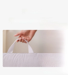 Detail of widened handles on honeycomb mesh laundry bag for machine wash protection