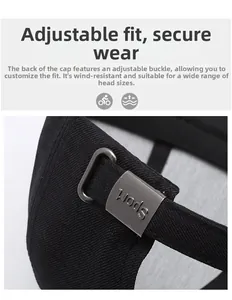 Detail of adjustable metal buckle with sport engraving on black cotton baseball cap