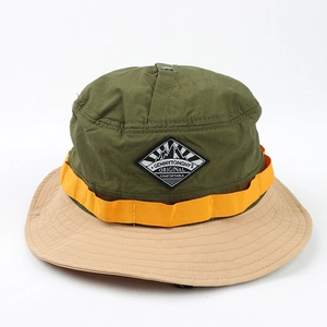 Detail of color-block outdoor bucket hat with orange webbing and quick-dry nylon fabric