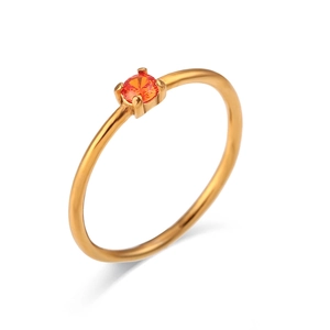 18K gold plated stainless steel ring with a round orange gemstone on a white background