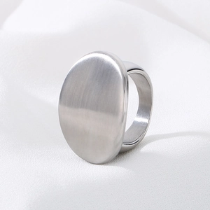 Retro Bohemian oval stainless steel ring with matte finish on white silk background
