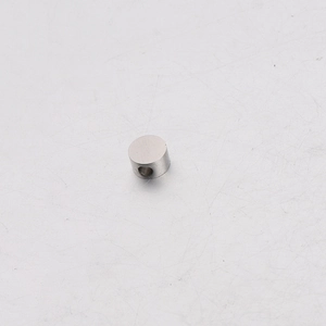 Detailed close-up of a 5mm polished stainless steel spacer bead with a 1.8mm hole for DIY