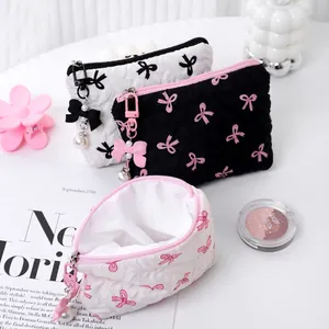 Chic quilted bow makeup bag set with pearl zipper charms in black and white colors