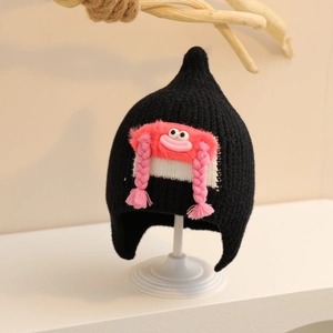 Detail of baby winter knit hat with cute pink cartoon face and braided tassels