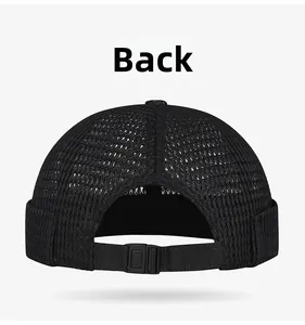 Detail of the adjustable nylon strap and plastic buckle on the black mesh docker hat