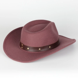 Close-up of wine red felt fedora hat featuring a brown leather band with gold metal studs