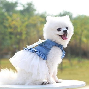 Detail of pet denim dress with white bow and layered tulle tutu skirt for small dogs